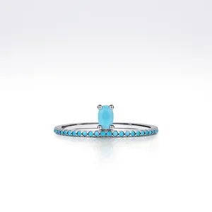S925 sterling silver ring featuring an oval turquoise center stone and pave accents
