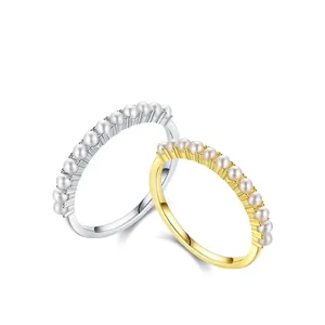 French style 925 sterling silver pearl rings in gold and silver set on white background