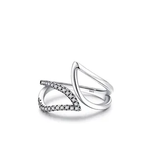 S925 sterling silver asymmetrical wave ring with pavé cubic zirconia on white background