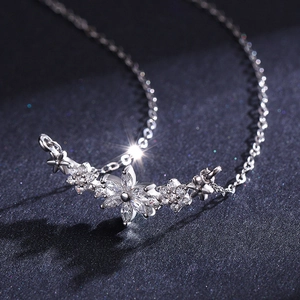 Elegant S925 sterling silver floral necklace with sparkling diamond-set flower petals