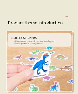 Close-up of thick jelly dinosaur stickers being applied to a clean background surface