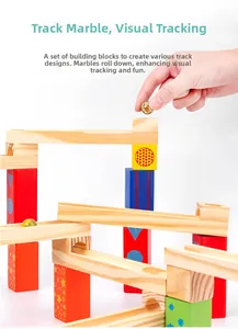 Detail showing wooden ball run track assembly with colorful blocks and glass marbles