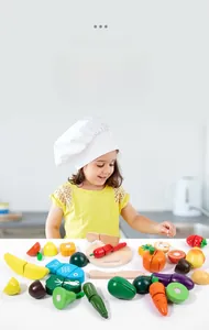 Close-up of wooden pretend play fruit and vegetable set with a toy knife and cutting board