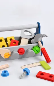 Macro view of polished wooden toy tools including hammer, wrench and nuts in a blue toolbox
