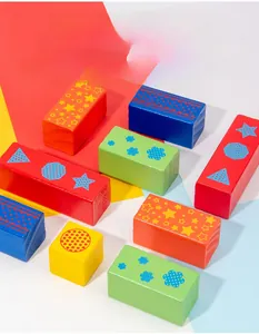 Close-up of colorful wooden building blocks with vibrant star and geometric prints