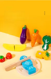 Macro detail of wooden toy food set with a toy knife and board for role play games