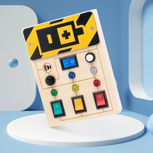Close-up of Montessori wooden busy board with colorful LED lights and toggle switches