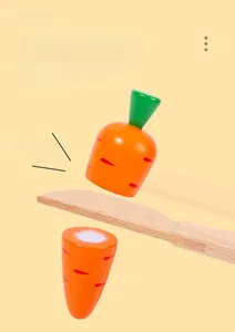 Wooden carrot play food detail showing simulation knife cutting through velcro joint