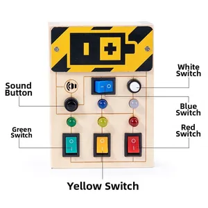 Detail of wooden busy board with colorful LED light switches and interactive buttons