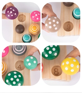 Detail of wooden Montessori puzzle showing hands matching colored mushrooms to number slots