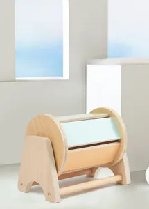Close-up of smooth hand-polished edges on a colorful Montessori wooden rolling drum toy
