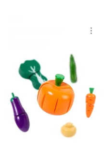 Macro detail of smooth wooden vegetable toys with vibrant colors and rounded edges
