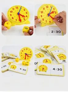 Close-up of children learning time with a yellow analog clock and logic matching cards