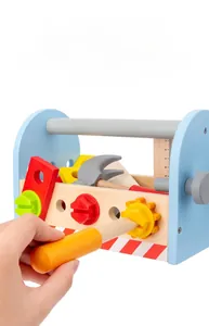 Macro shot of children's wooden tool box set showing nuts, bolts, and measurement ruler