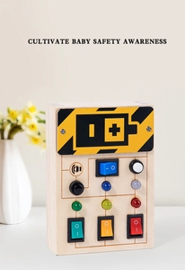 Detail of wooden sensory busy board with colorful LED light switches for baby safety awareness