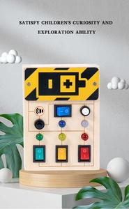 Macro shot of wooden busy board with colorful LED light toggles and interactive switches