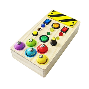 Macro shot of Montessori wooden busy board featuring colorful LED lights and power switches