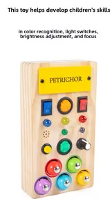Macro detail of wooden busy board sensory toy with colorful LED switches and toggle knobs