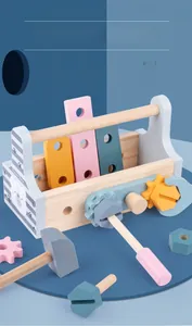 Macro view of wooden tool box with colorful screws, gears and hammer for kids