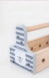 Close-up of wooden kids tool box with bear graphic and sturdy carrying handle