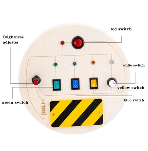 Detail of wooden busy board showing colorful LED switches and brightness adjuster knob