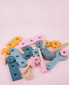 Macro detail of smooth wooden nuts and bolts toy with safe rounded edges in pastel colors