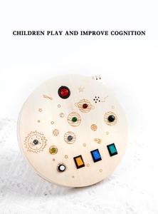 Macro shot of solar system wooden busy board with colorful LED lights and rocker switches