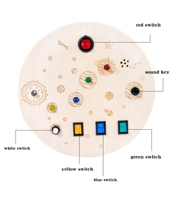 Close-up of wooden space busy board toy with colorful LED switches and laser engravings