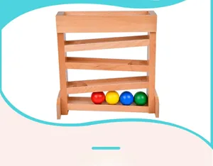 Close-up of wooden Montessori visual tracking toy with four colorful rolling balls and ramps