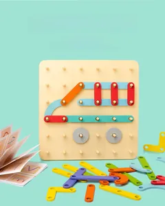 Detail of wooden geometric puzzle blocks with multi-color pieces and pattern guide book