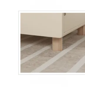 Detail of wooden fridge legs with DIY stickers for kids' Nordic pretend play set