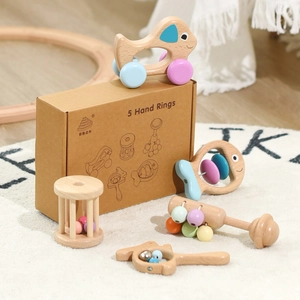5-piece wooden baby rattle set with pastel tones and natural wood finish in a gift box