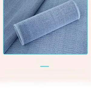 Blue Montessori work rug shown rolled up for easy storage with fine knitted texture
