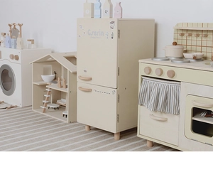 Nordic style wooden kitchen playset showing detail of toy fridge and stove cabinet