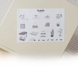 Detailed view of coffee-themed hand-drawn stickers for kids Nordic kitchen playset