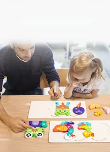 Detail showing interactive wood puzzle of frog life cycle stages for kids' early learning