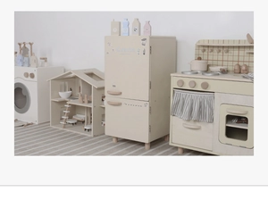 Nordic wooden toy kitchen set featuring miniature fridge, stove and dollhouse in soft tones