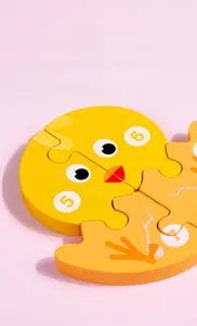 Close-up of thick wooden duck puzzle with numbers for toddlers early learning