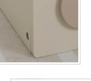 Detail of premium painted wood panels and assembly holes for kids play kitchen