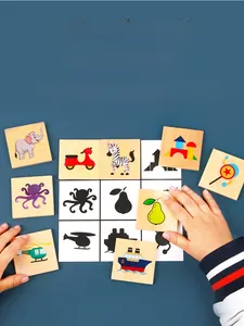 Detail of wooden shadow matching tiles showing animal and vehicle patterns for toddlers