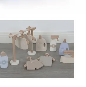 Detailed set of wooden laundry toys including drying rack hangers and miniature accessories