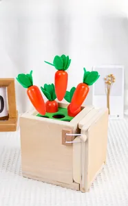 Close-up of wooden Montessori pulling carrot toy set with felt leaves on knit surface