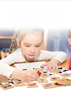 Close-up of a child matching vibrant wooden animal puzzles to their shadows on a board