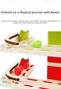 Close-up of wooden marble run track with colorful balls for kids' skill training