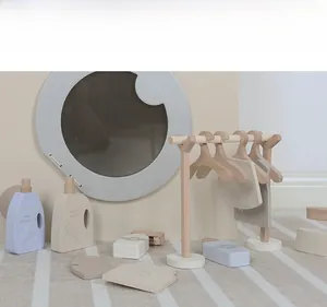 Nordic wooden laundry play set with miniature washing machine and drying rack details
