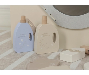 Close-up of Nordic style wooden toy laundry detergent bottles and fabric softeners