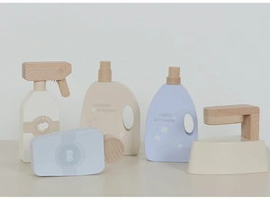 Macro shot of Nordic wooden laundry set including detergent bottles and iron for kids