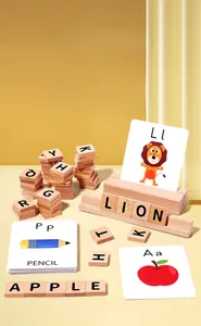 Close-up of wooden alphabet blocks with spelling flashcards for early childhood learning