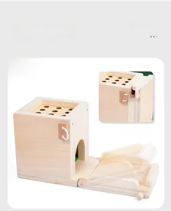 Detail showing foldable Montessori wooden coin box for space-saving toy storage