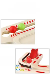 Macro detail of wooden marble run track with colorful rolling balls and arrow marks